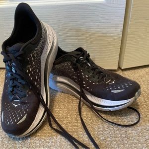 Hoka black and grey running shoes